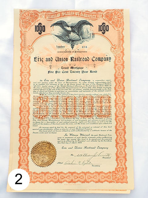 Erie & Union Railroad Co bond photographed against flat surface