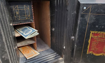 Small safe with cubbyholes for holding stocks, bonds and other small documents