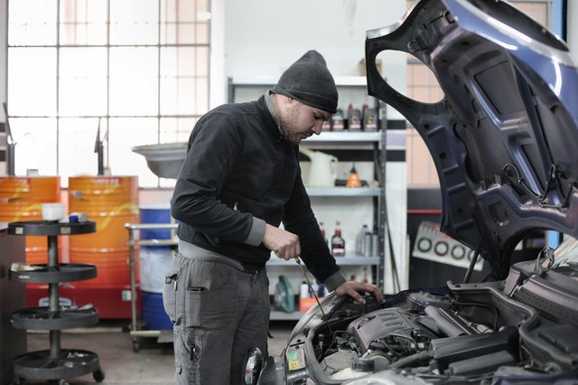 Man looking 'under the hood.' Photo by Andrea Piacquadio from Pexels 